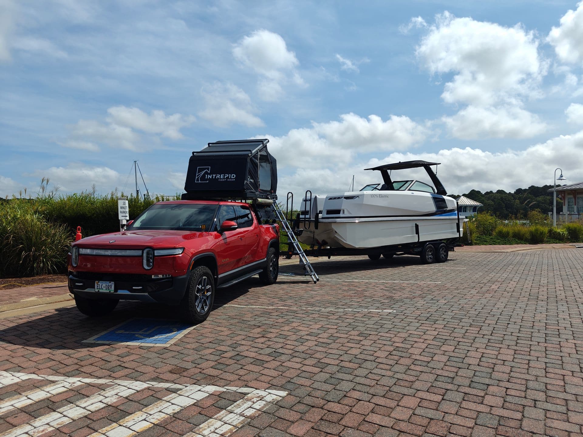 Electrified Marina vehicle towing an electric boat