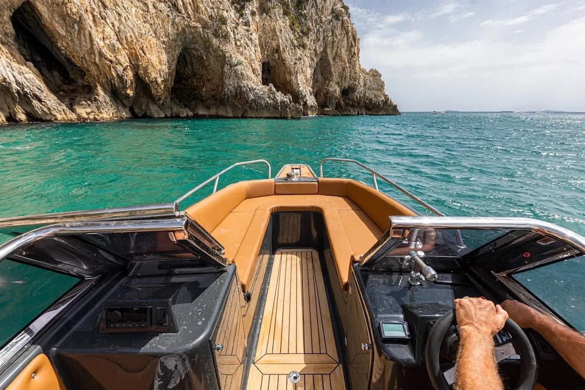 seating area at the bow of the magonis boat with light brown interior